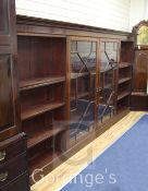 A large Edwardian mahogany bookcase, with two central astragal glazed doors flanked by open