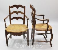 Two 19th century French rustic elbow chairs, with rush seats