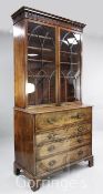 A George III mahogany secretaire bookcase, with moulded cornice over astragal glazed doors,
