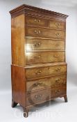 A George III mahogany chest on chest, with moulded cornice, two short and six graduated long