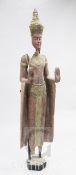 An Eastern parcel gilt and painted wood model of a standing female figure, 5ft 8in.