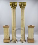 A pair of stripped pine columns, with square bases and gilt Corinthian capitals, H.9ft 3in.