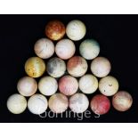 A collection of twenty early 20th century ivory snooker balls, some with traces of original