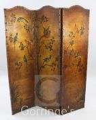 An early 20th century three fold leather dressing screen, painted with birds upon branches, H.5ft