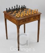 An early 20th century French inlaid oak chess table, with Jaques style chessmen, kings 4.5in.