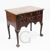 A George II mahogany lowboy, with four drawers and claw and ball feet, W.2ft 6in.