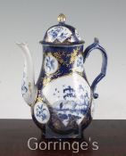 A Worcester powder blue ground coffee pot and cover, c.1760-70, decorated with the 'Fisherman in Fan