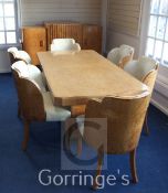 An Art Deco burr maple dining suite, probably Epstein, comprising table and six cloud back chairs