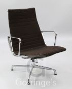 A Charles Eames aluminium chair, by Vitra, with chrome frame and ribbed brown fabric upholstery