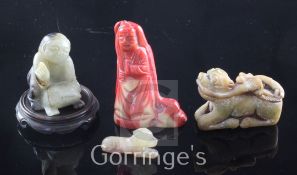 Two Chinese jade figures, a bowenite figure and a coral figure, the first of celadon black jade