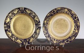 Two German porcelain gilt-decorated cabinet plates, early 20th century, the first decorated with