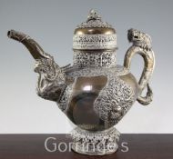 A Tibetan bronze and paktong teapot and cover, late 19th / early 20th century, decorated with