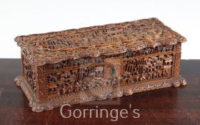 A Chinese export sandalwood rectangular box, mid 19th century, carved in high relief with figures