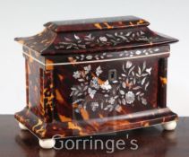 An early Victorian mother of pearl inlaid tortoiseshell tea caddy, of bowfronted form, the underside