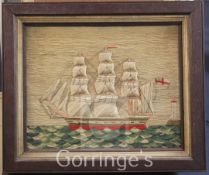 A Victorian woolwork ship picture depicting a frigate and lighthouse, 12.5 x 15.5in.