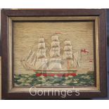 A Victorian woolwork ship picture depicting a frigate and lighthouse, 12.5 x 15.5in.