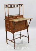 An Arts & Crafts walnut student's desk, with raised superstructure, W.2ft