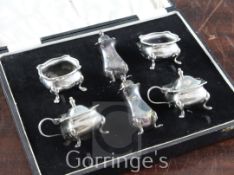 A cased 1930's six piece silver condiment set, on cabriole feet, William Suckling Ltd, Birmingham,