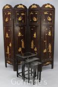 A Chinese lacquered four fold draught screen, gilt decorated with figures in relief, height 6ft