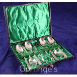 A cased set of six Edwardian silver Old English pattern tea spoons and tongs, with engraved