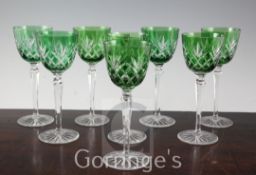 A set of eight green bowled cut glass hock glasses