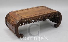 A Chinese hardwood rectangular topped opium table, the scroll ends carved with prunus blossom, width