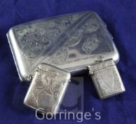 A George V silver cigarette case and two silver vesta cases, the former with engraved decoration,