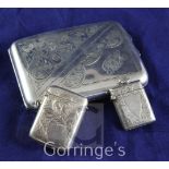 A George V silver cigarette case and two silver vesta cases, the former with engraved decoration,