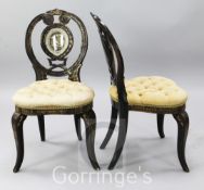 A pair of mid 19th century gilt lacquered mahogany effect boudoir chairs, the pierced balloon shaped