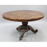 A Victorian rosewood breakfast table, with fluted stem and scroll feet, W.4ft 4in.