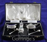 A cased 1960's silver three piece condiment set with two spoons, Cooper Brothers & Sons,