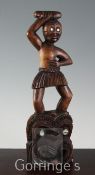 A Maori style carved wood effigy, with abalone inlaid eyes, 40.5cm