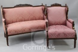 An early 20th century mahogany framed two seat sofa and matching armchair, in neo-classical style,
