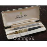 A Parker 61 14k rolled gold fountain pen and a Waterman pen