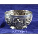 A 20th century Burmese silver bowl, embossed with deities, dia. 4in, 3 oz.