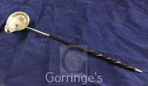 A George III silver toddy ladle, with fluted bowl and demi-spiral twist baleen handle, Thomas