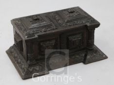 A miniature 17th century style Italian carved oak cassone, fitted with a pair of mask carved