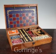 A mahogany cased games compendium, chess, draughts and a horse racing game, 35.5cm