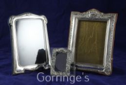 Three repousse silver rectangular photograph frames, in size order, largest, W.J. Myatt & Co,