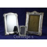 Three repousse silver rectangular photograph frames, in size order, largest, W.J. Myatt & Co,