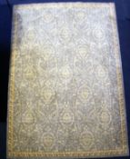 A Chinese rug,with damask scroll decoration, on a pale blue ground,7ft 5in. by 5ft 3in.