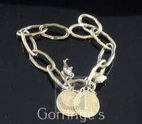 A Peter Farrar of Rye gold bracelet, hung with four charms including two mounted gold coins, gross