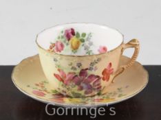 A Royal Worcester blush ground tea cup and saucer, painted with flowers and a collection of twelve