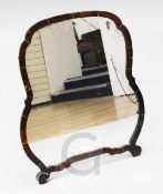 A tortoiseshell framed easel mirror, the cartouche shaped plate 20 x 18in.