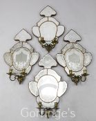 A set of four early 19th century Venetian etched mirrored glass girandoles, the cartouche shaped