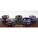 Five Moorcroft pottery sundae dishes, 1930's, in pansy and pomegranate pattern, slight damage,