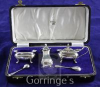 A cased 1960's silver three piece condiment set with two spoons, S.J. Rose & Son, Birmingham, 1966.