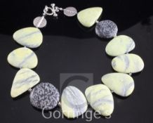 A shaped pebble necklace with two silver medallions and a silver clasp, 20.5in.