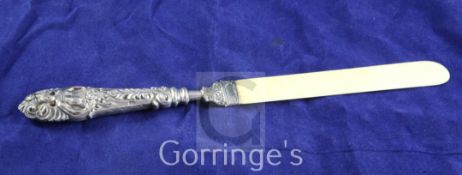 A late Victorian repousse silver handled ivory letter opener, Crisford & Norris, Birmingham, 1899,