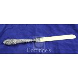 A late Victorian repousse silver handled ivory letter opener, Crisford & Norris, Birmingham, 1899,